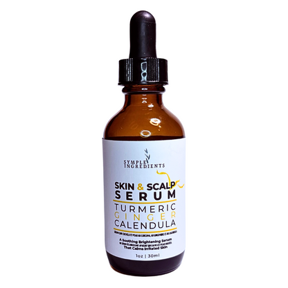 Turmeric ginger calendula all natural skin and scalp serum in an amber  glass bottle with dropper for portion control. 